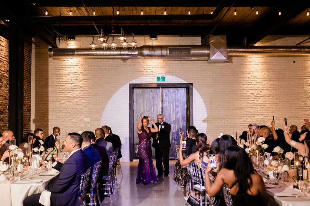 Guests fancing as an entrance at the Eglinton West Gallery wedding
