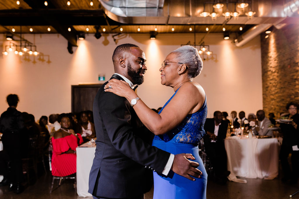 Groom dance with mother at Eglinton West Gallery Wedding