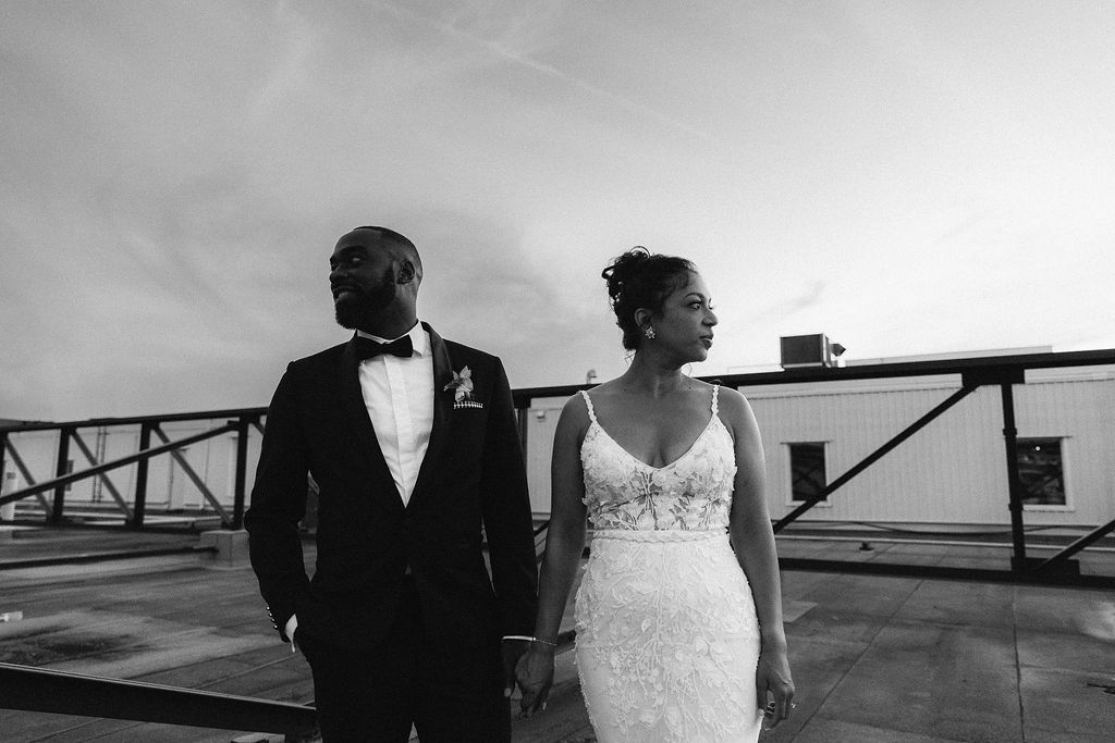 Bride and groom on rooftop of Eglinton West Gallery, black and white